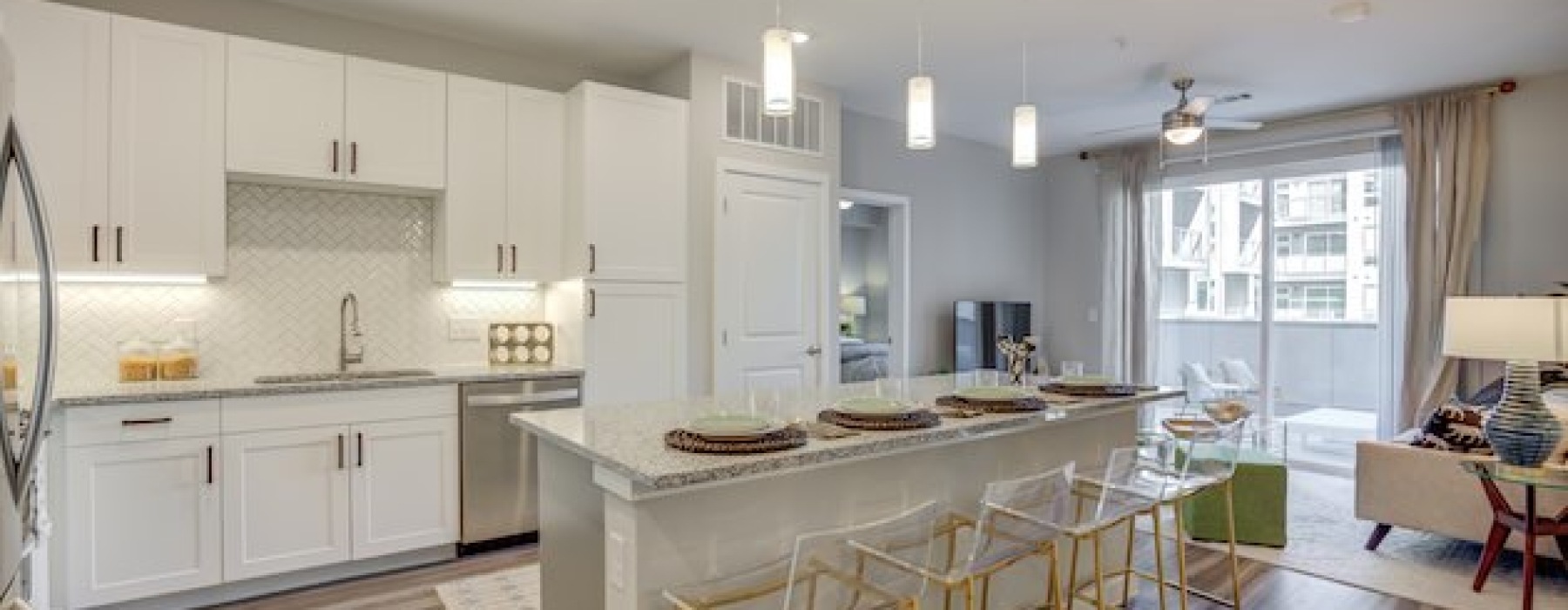 A well-lit kitchen with ample counter space at The Grove Austin luxury apartments.