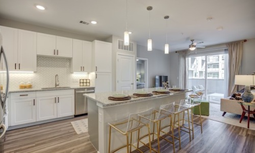 A well-lit kitchen with ample counter space at The Grove Austin luxury apartments.