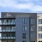 exterior shot featuring Alder at The Grove logo