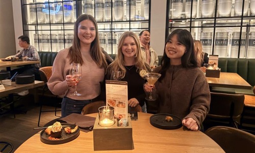three young women with champagne