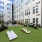 Large courtyard with BBQ stations and green space 