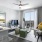 Spacious and well-lit living room with wood flooring and french doors at Korina at The Grove, a new apartment complex in Austin, TX